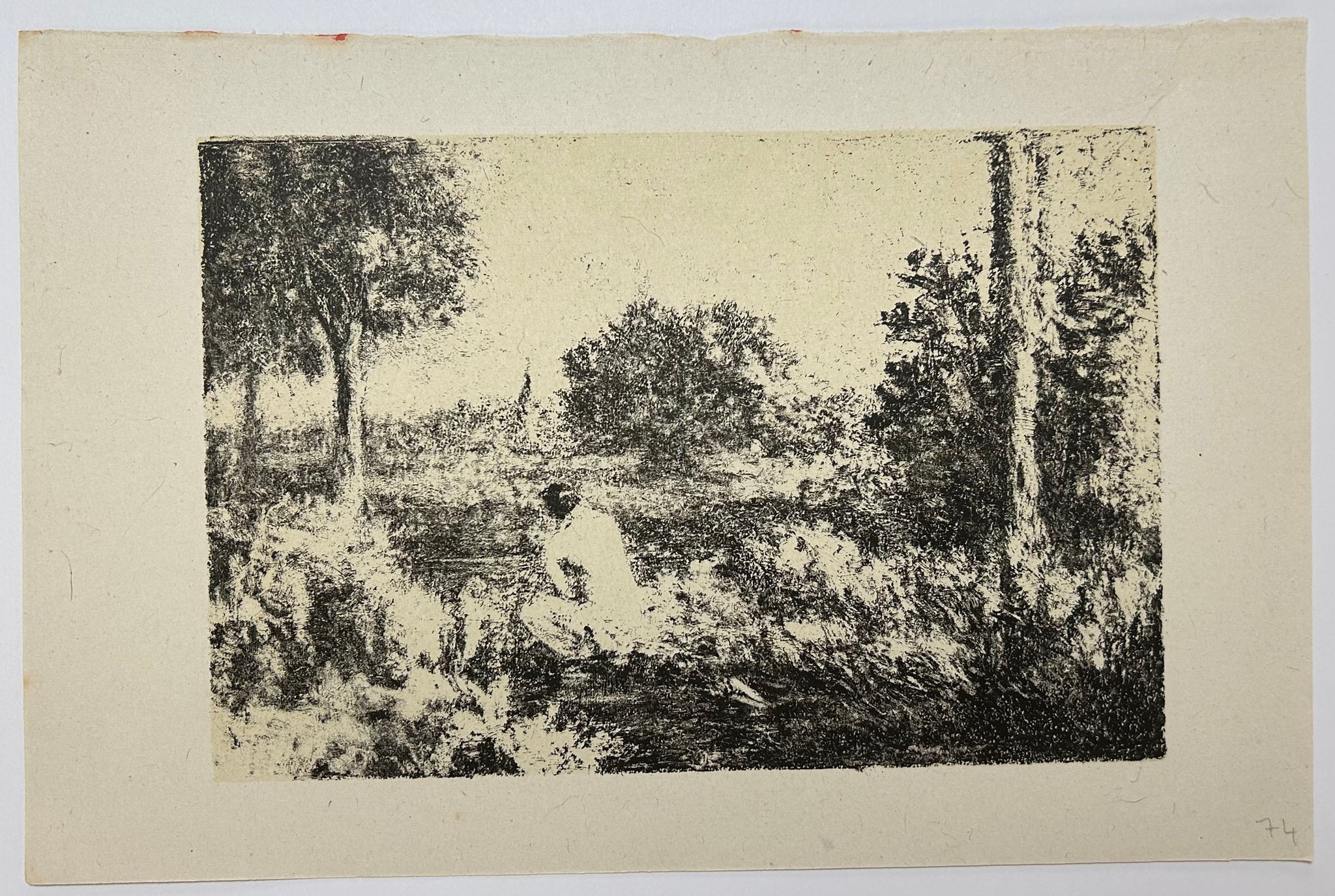 Jeune femme assise au bord d'une rivière en Île de France.