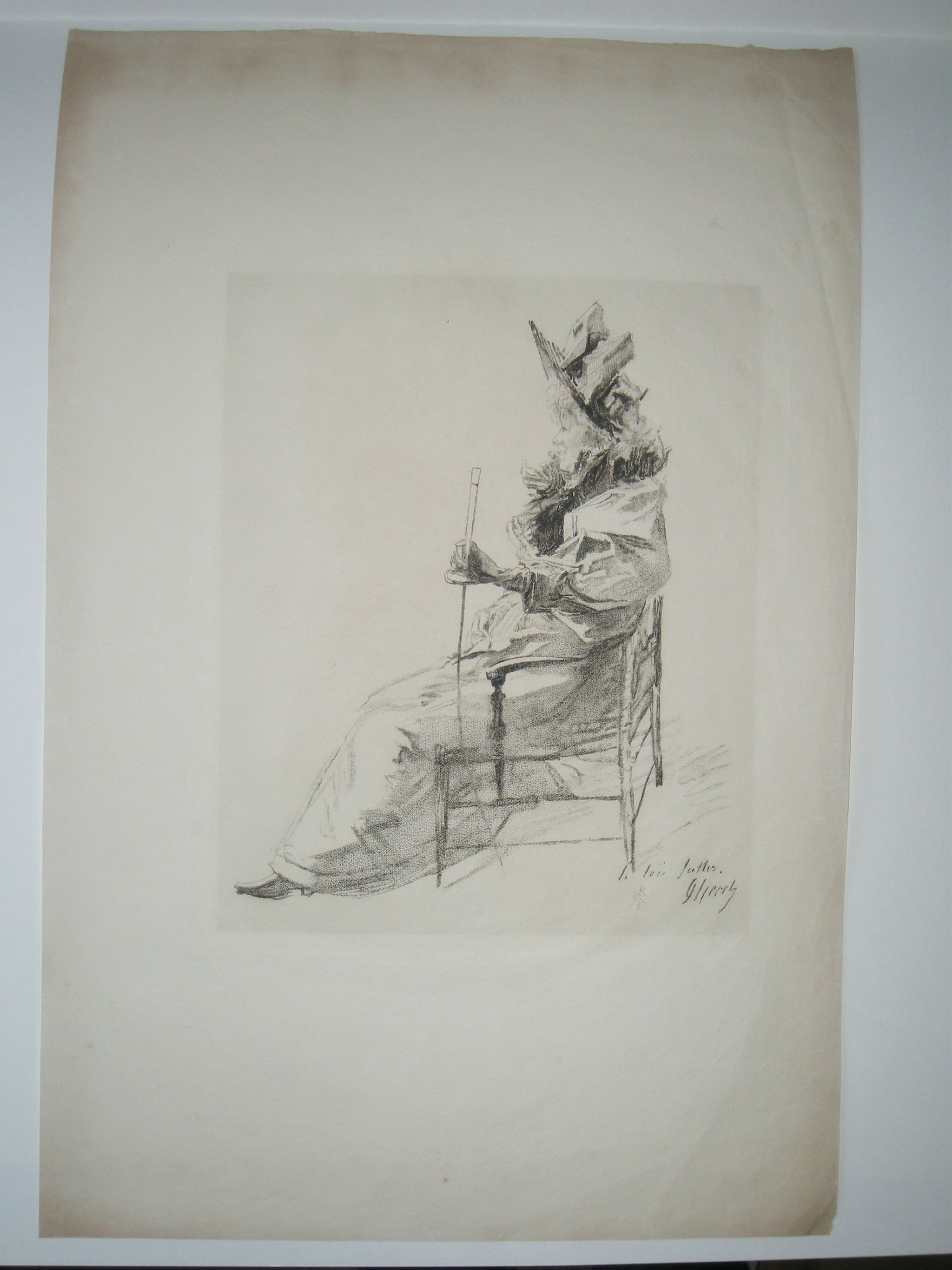 La Loïe Fuller, assise de profil à gauche.