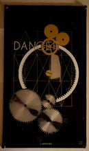 Charger l'image dans la galerie, MAN RAY - L'impossible.  1969. Sérigraphie sur verre acrylique, d'après un dessin de 1918 ("Perpetual Motion") et une peinture de 1920 ("Danger"). Verre acrylique et plexiglass monté sur un support en bois. 
