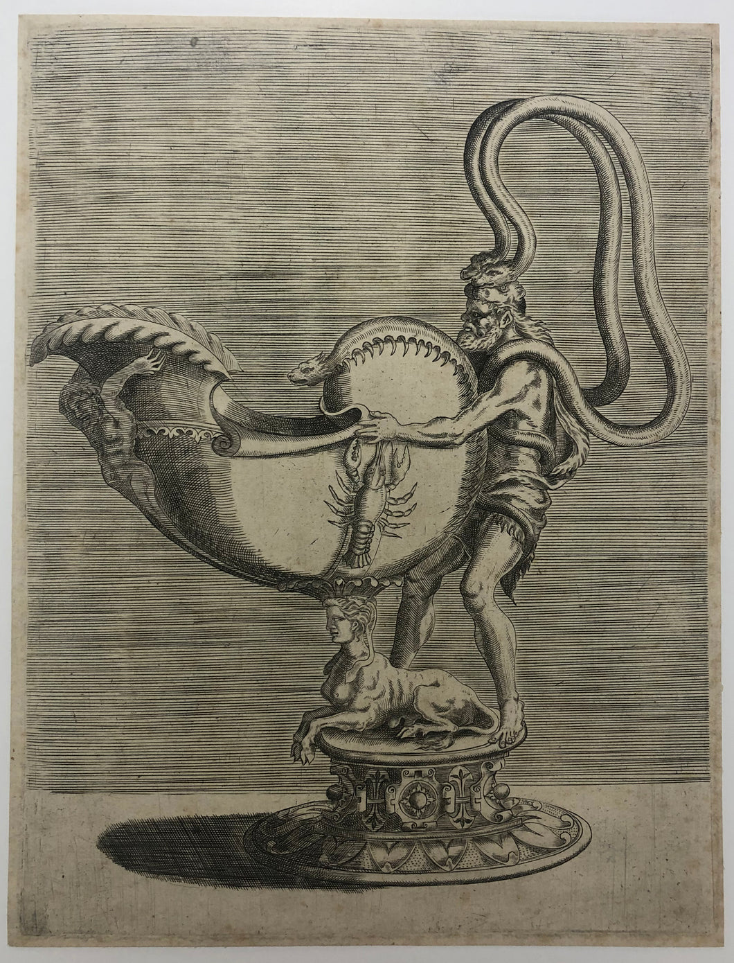 Aiguière portée par un homme et soutenue par un sphinx. Les oreilles sont formées par deux serpents qui se balancent des épaules de l'homme avec une courbe vers sa tête. c.1548.