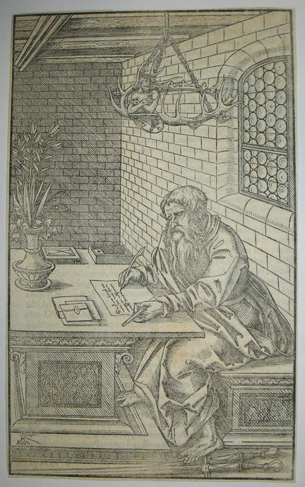 Saint Paul, dans un intérieur, assis à une table.